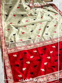 Kaziranga Assam Cotton Blend Saree in red and pista green color with rhino motifs