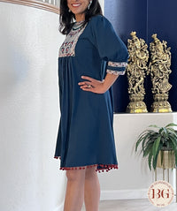 Knee Length dress in gorgeous blue color with red pompom