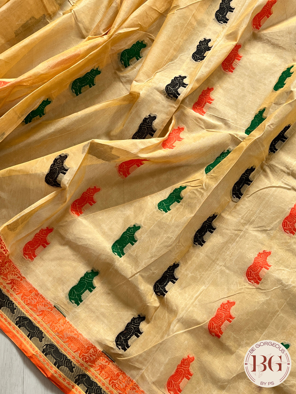 Kaziranga Assam Cotton Blend Saree in CREAM ORANGE color with rhino motifs