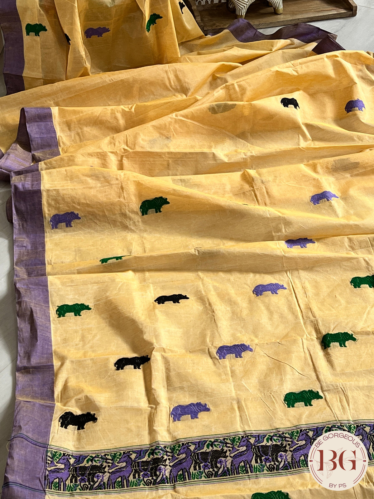 Kaziranga Assam Cotton Blend Saree in CREAM PURPLE color with rhino motifs