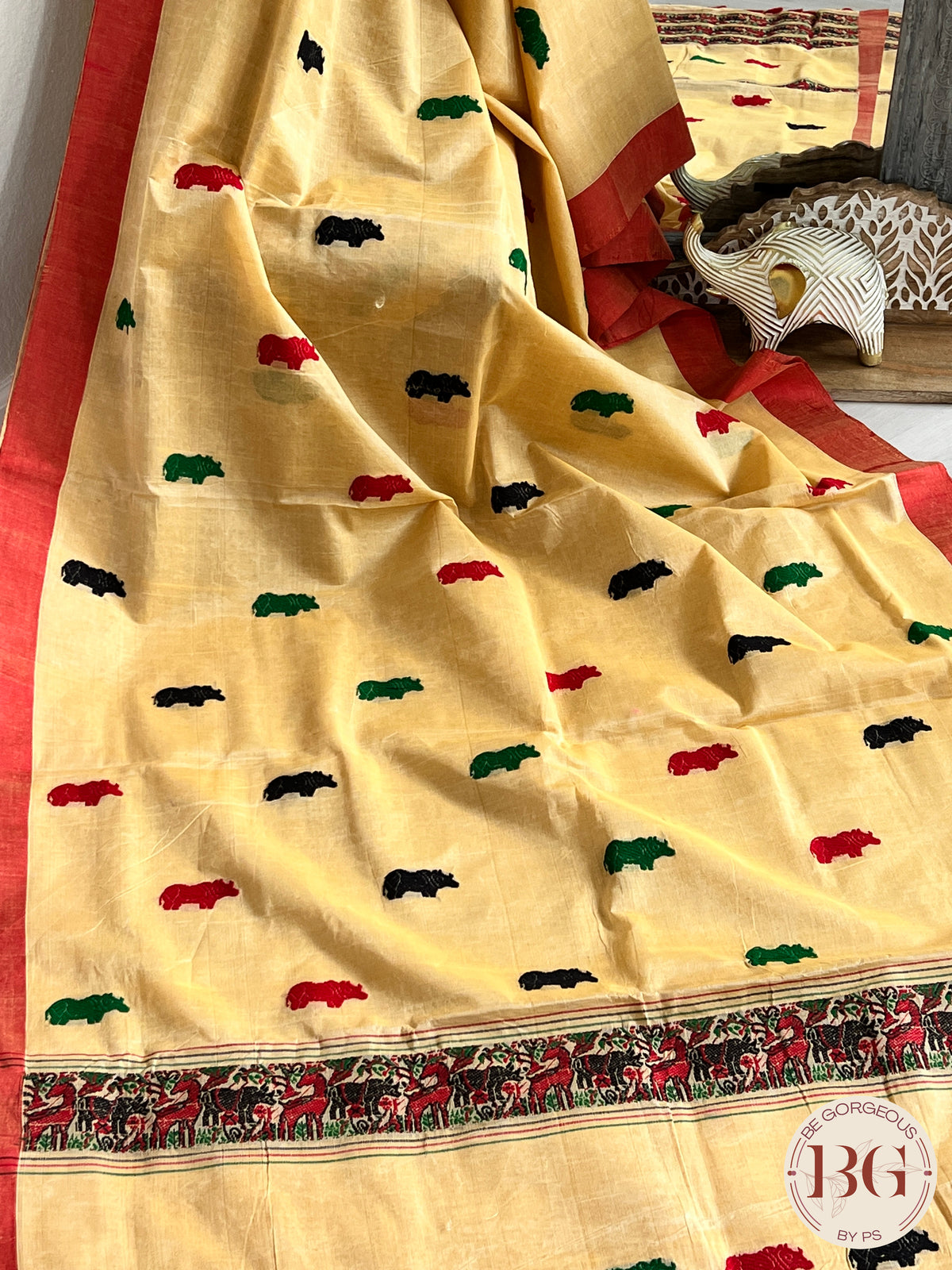 Kaziranga Assam Cotton Blend Saree in CREAM RED color with rhino motifs