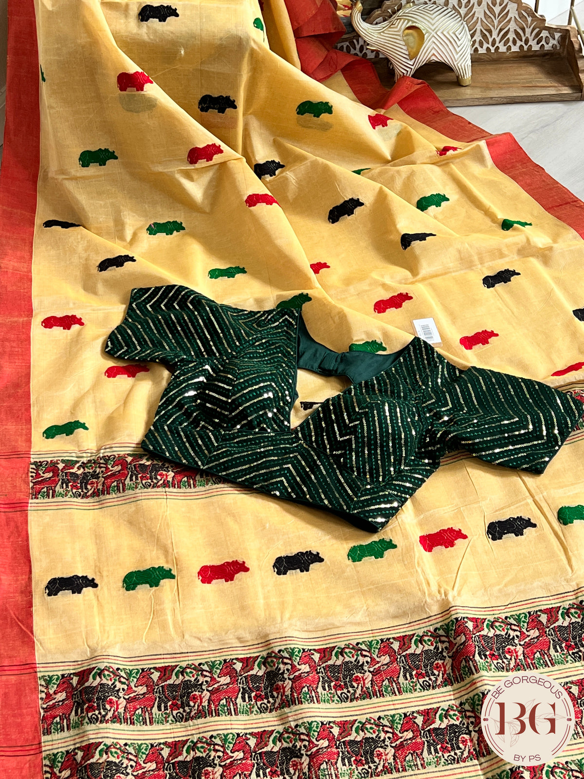 Kaziranga Assam Cotton Blend Saree in CREAM RED color with rhino motifs