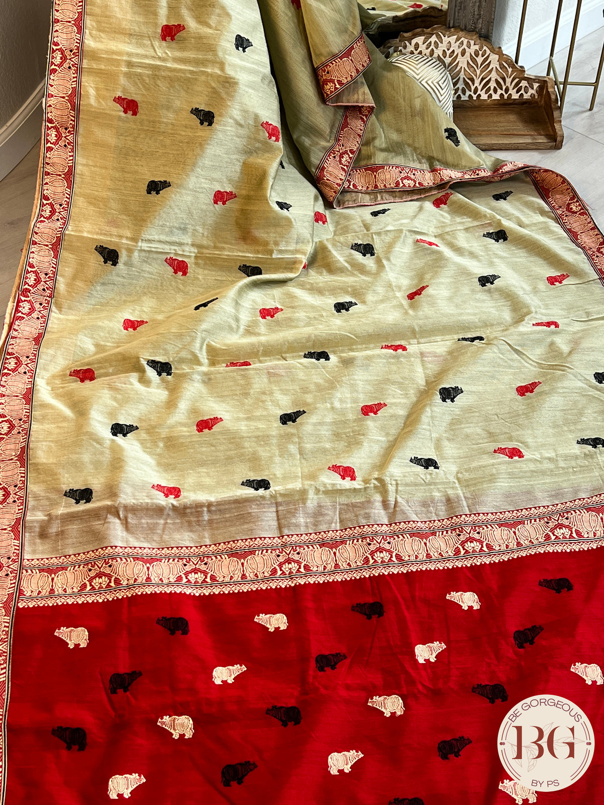 Kaziranga Assam Cotton Blend Saree in red and pista green color with rhino motifs