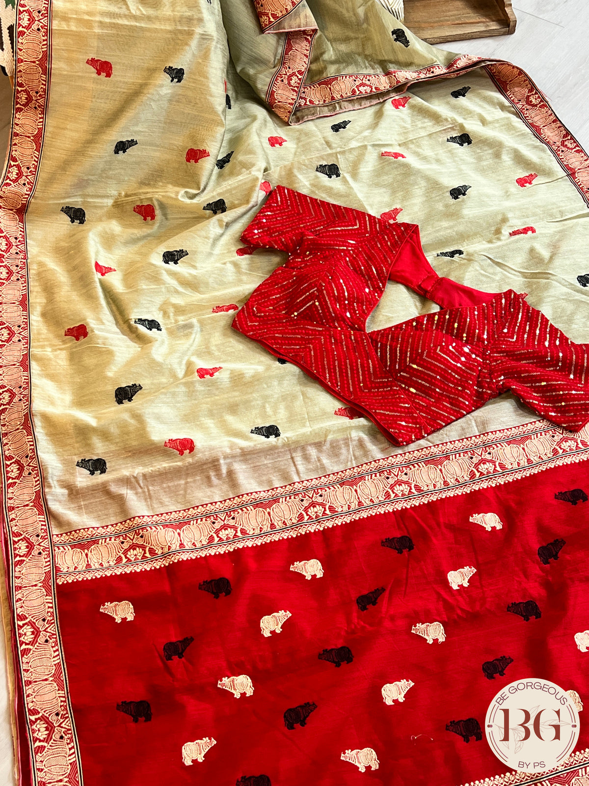 Kaziranga Assam Cotton Blend Saree in red and pista green color with rhino motifs