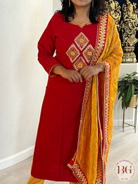 Party wear 3 piece suit in gorgeous red and yellow color combination. Muslin silk cloth.