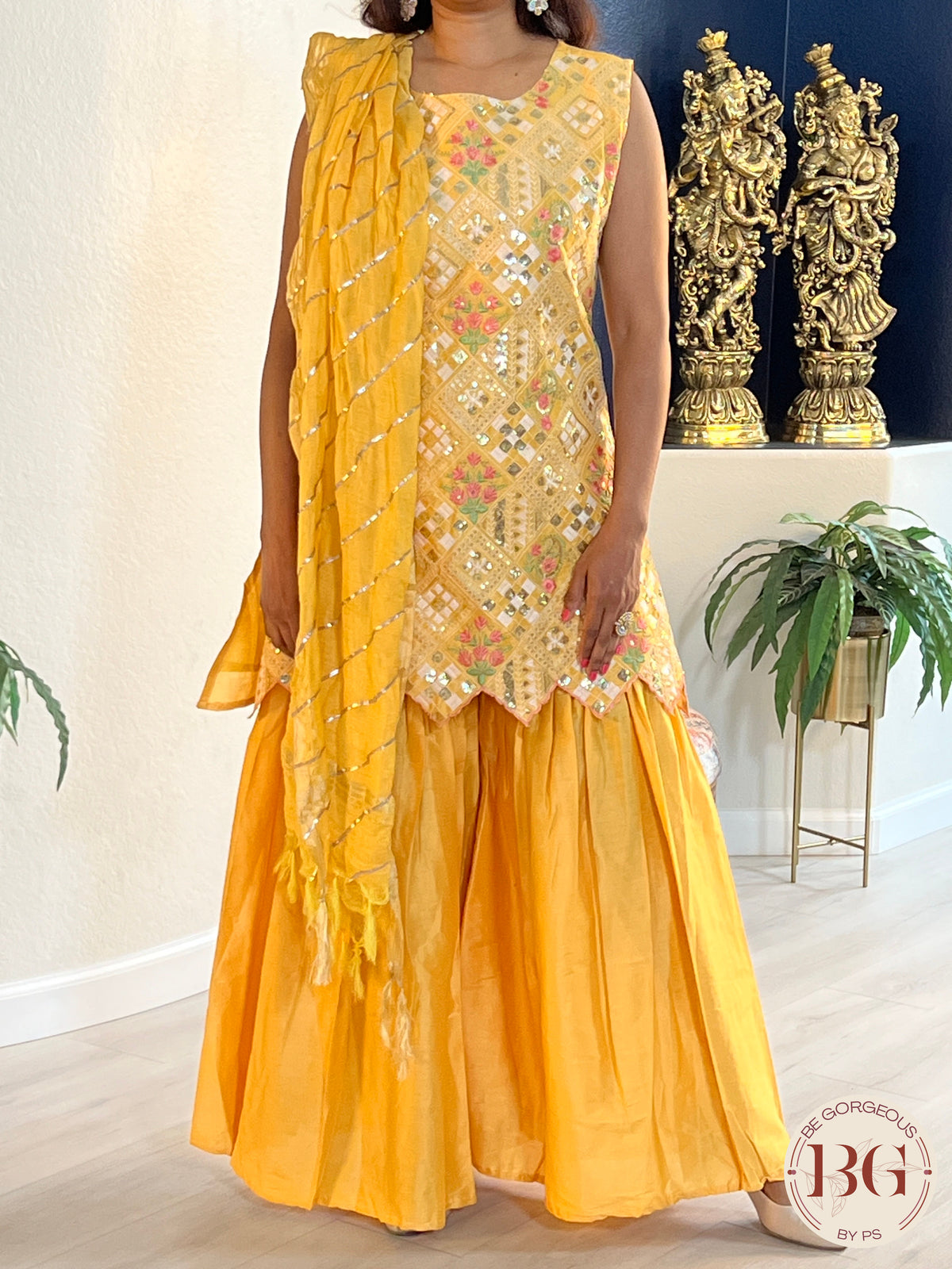 Garara set in gorgeous yellow color with gota and thread work