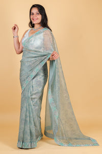 Net saree with print, swarosvki and sequin work - blue color