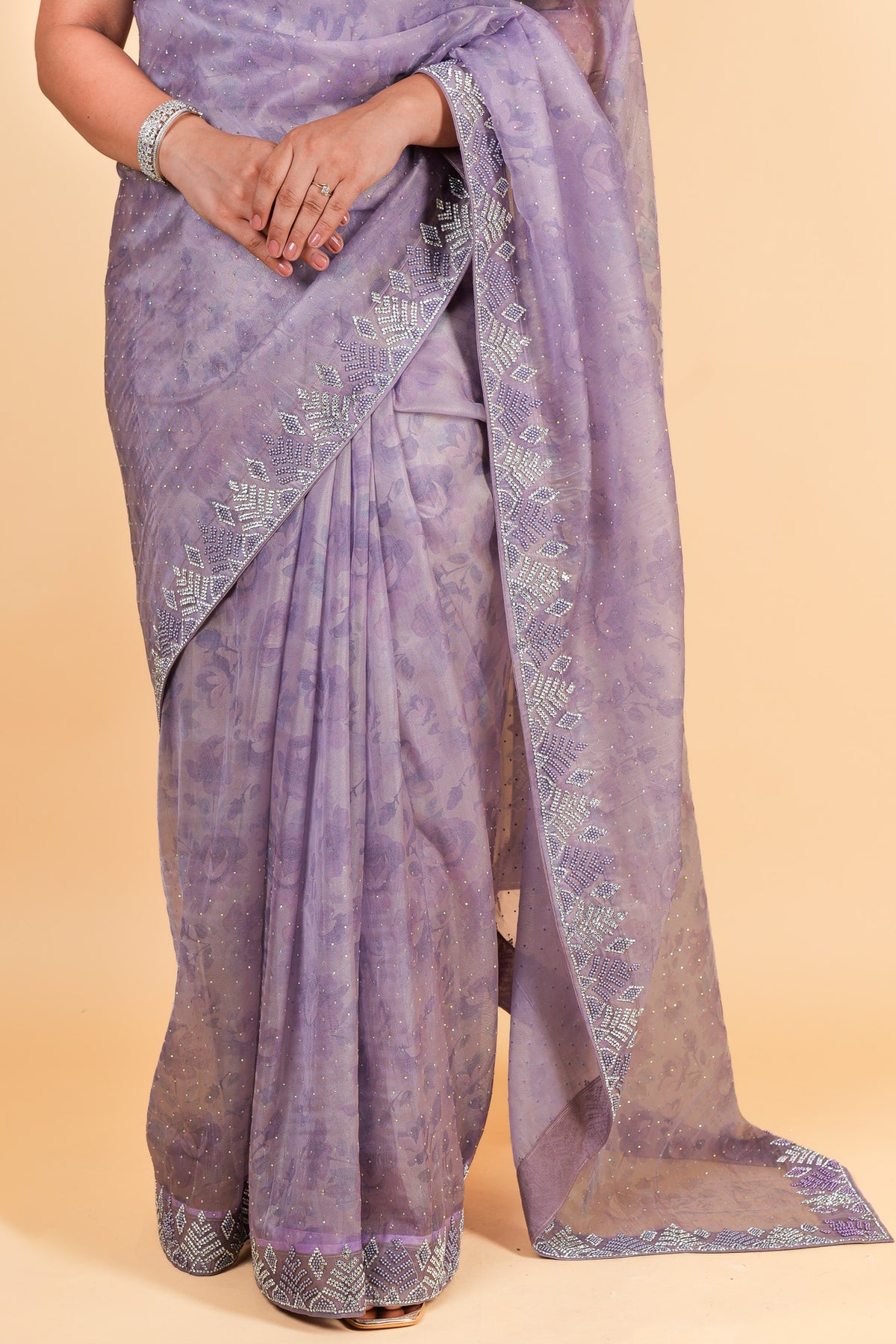 Net saree with print, swarosvki and sequin work - purple color