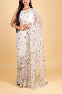 Net saree with multicolor thread embroidery, swarosvki and sequin work - off white color