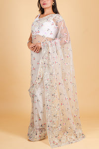 Net saree with multicolor thread embroidery, swarosvki and sequin work - off white color