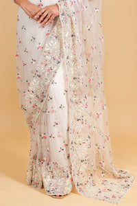 Net saree with multicolor thread embroidery, swarosvki and sequin work - off white color