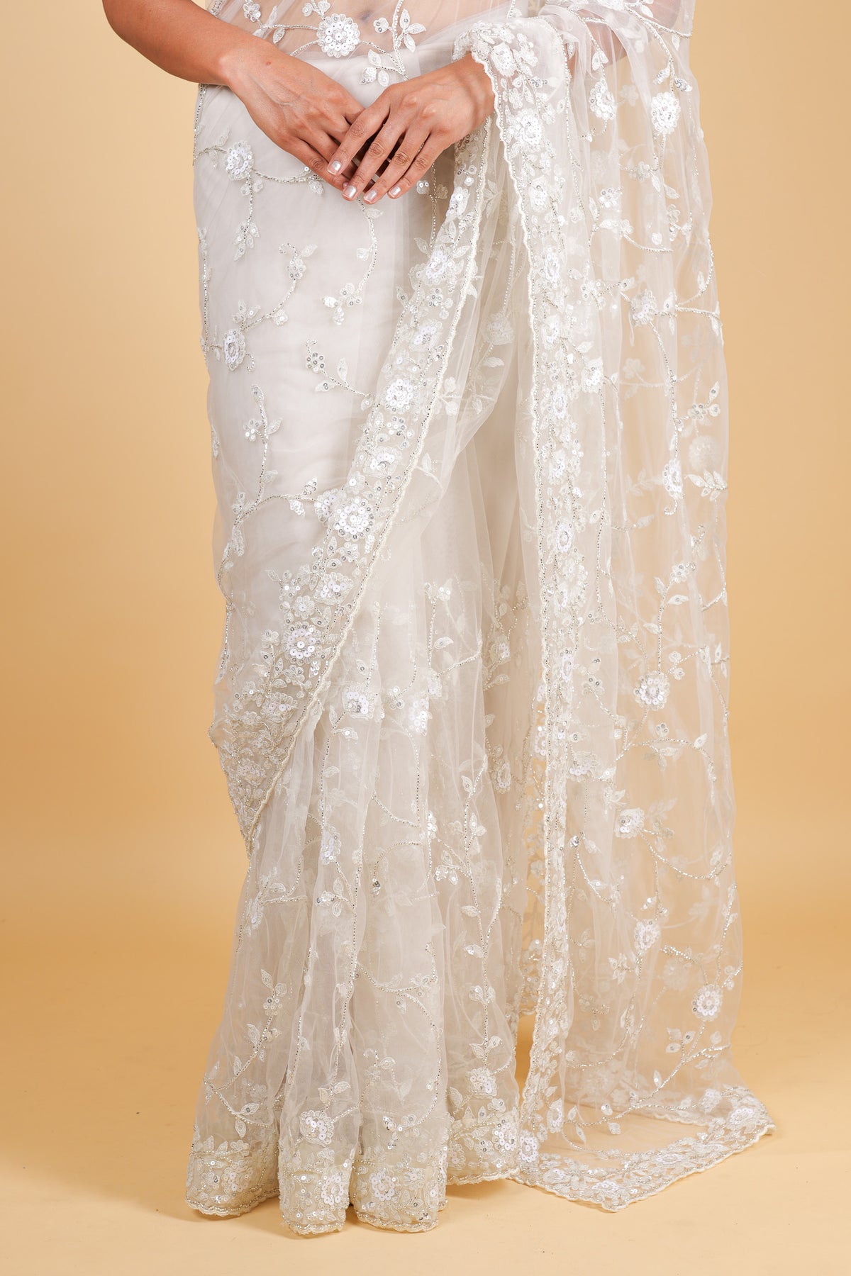 Net designer saree with thread embroidery and sequin work - cream color