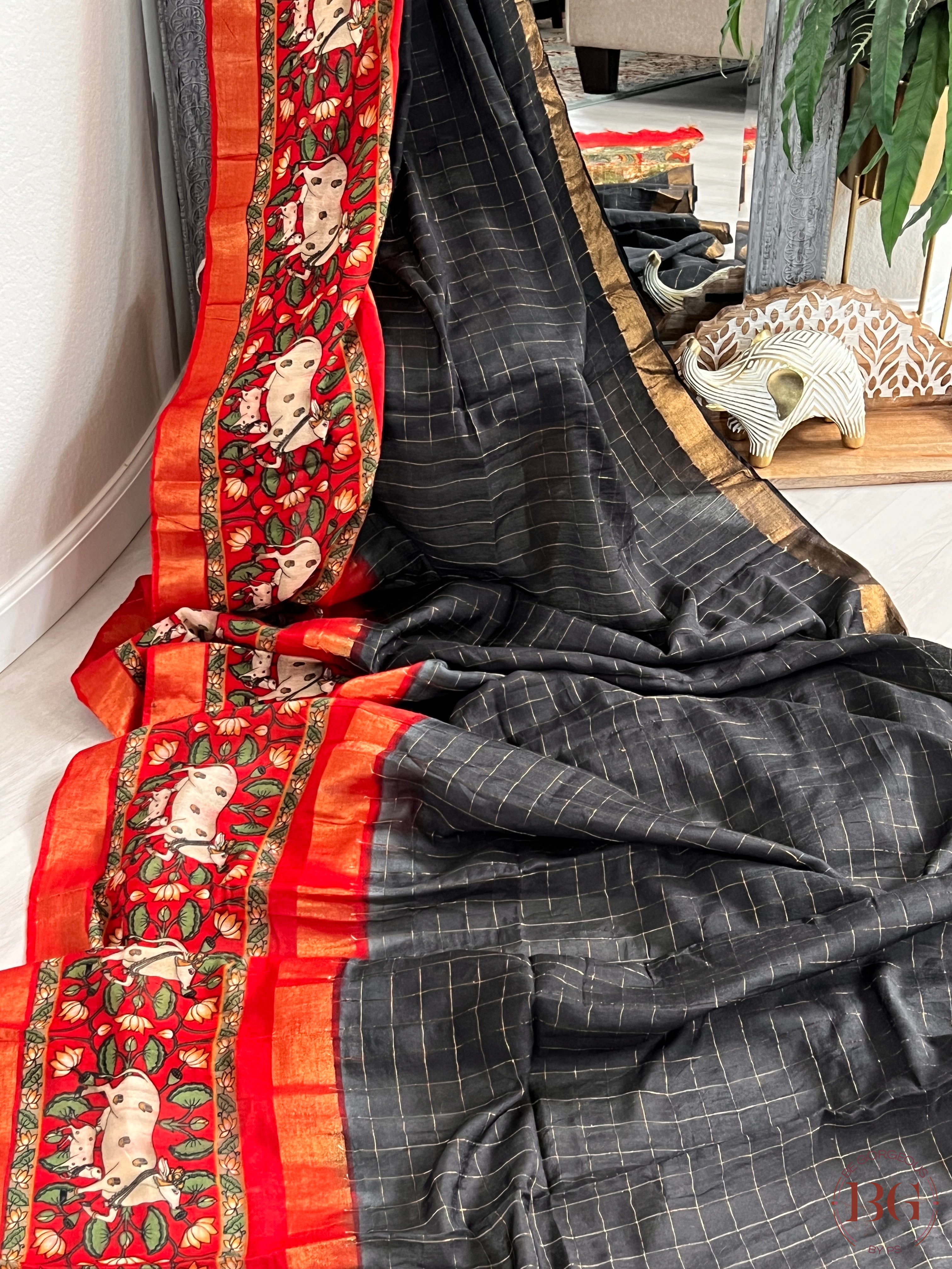 Soft linen silk saree with zari weaving checks & contrast pichwai digital printed border saree color - black